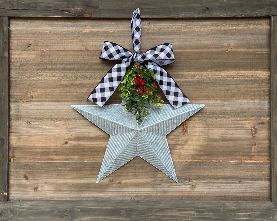 Farmhouse holiday decor, galvanized metal star with bow, Christmas door hanger with greenery and red berries